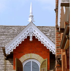 Ornate architectural detailing is fashioned from wood.
