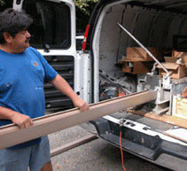 The extrusion machine inside the van produces a perfectly formed gutter