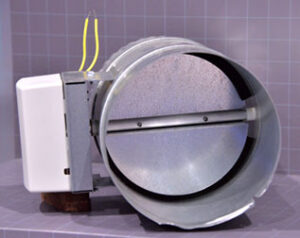 Motorized damper for a zoned system is  controlled by small motor to allow the flow of cooled (or heated) air.