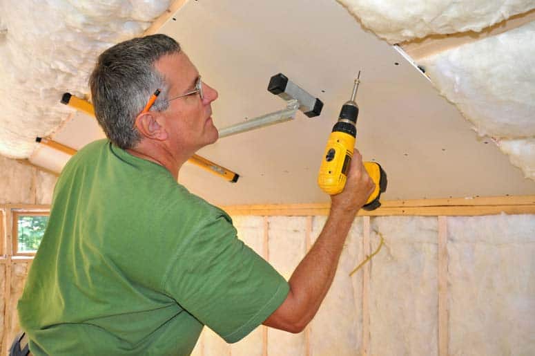 Use drywall screws to fasten sheets to ceiling joists.