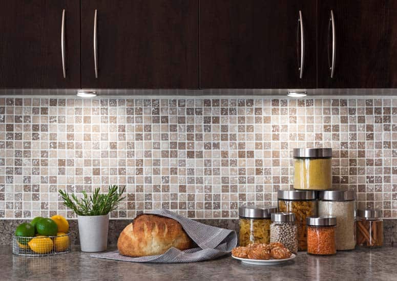 Mosaic tile backsplash provides a stunning, durable wall between countertop and cabinets.