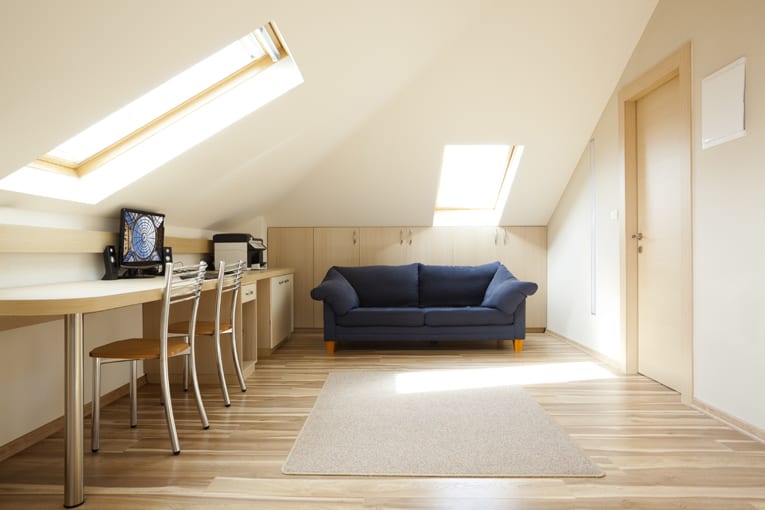 This attic office space is given natural light and a view through generous skylights.