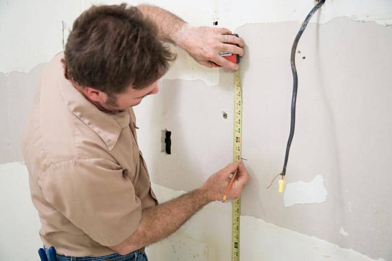 Measure up from your baseline to determine the location of the upper cabinets.
