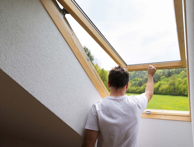 Roof windows and skylights in finished attic rooms can be operated manually.
