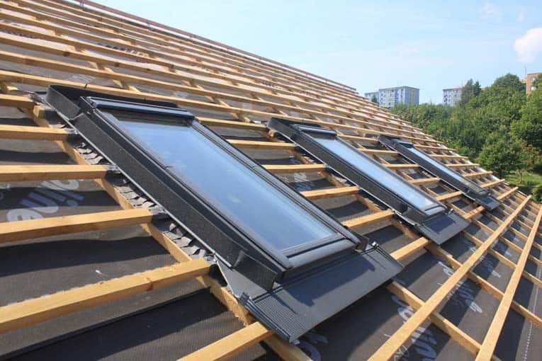 Skylights have integral metal flashing that seals them into the surrounding roofing.