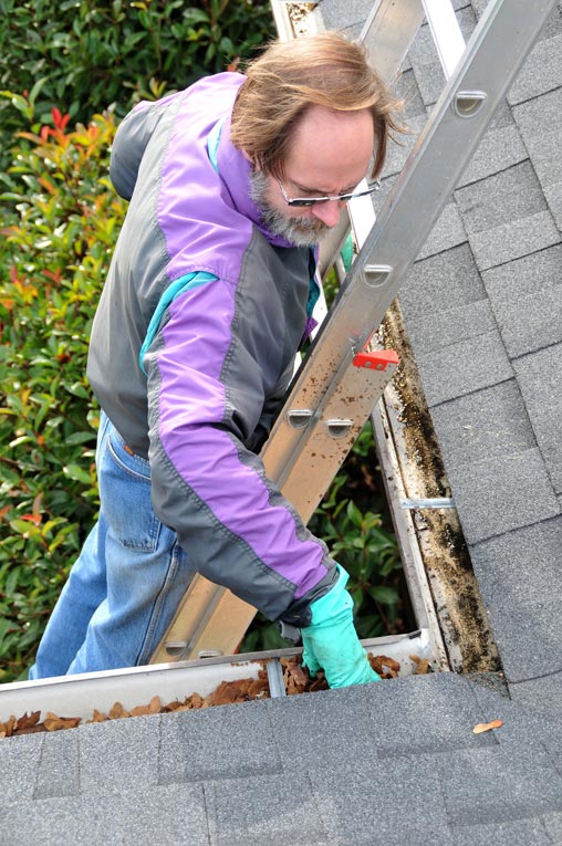 Work from a sturdy ladder and wear gloves to protect your hands from sharp metal and sheet metal screws.