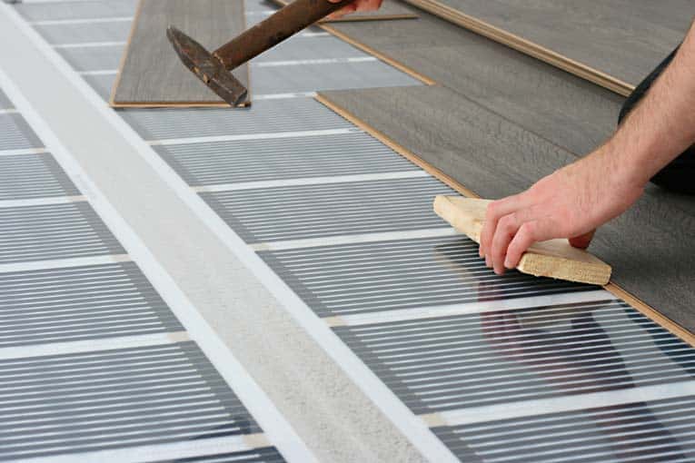 This infrared-carbon electric heating system is designed to go directly beneath surface flooring.