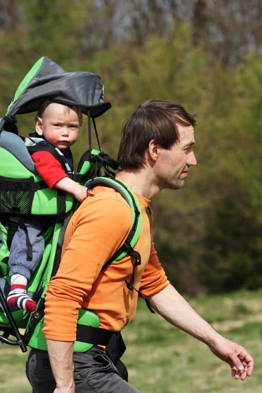 Riding in a fully-outfitted baby backpack lets baby hike with dad.