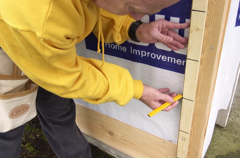 Create and use a story pole to transfer marks for each siding board at the corners.