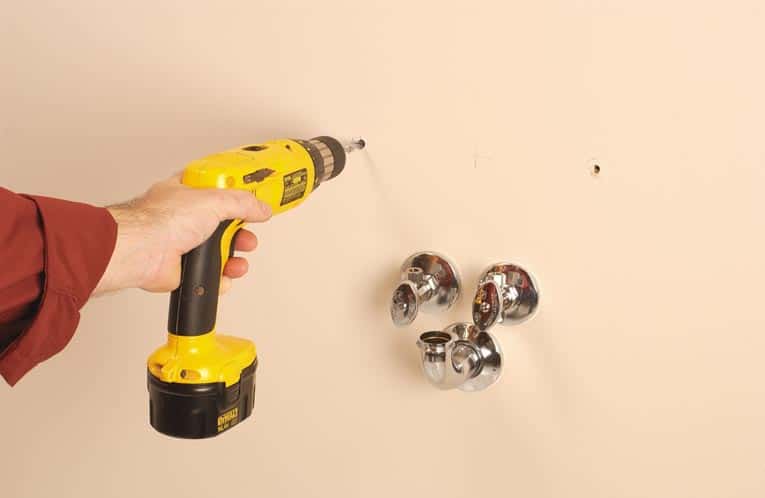 Drill holes for screws and fasteners.