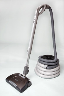 Beam EasyReach central vacuum powerhead connected to a retractable hose.