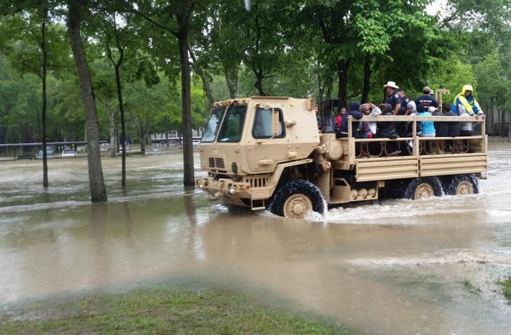 flooding victims transported by truck