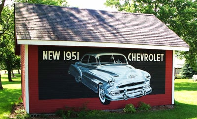 garage with old 1951 painting on the side