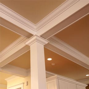 coffered ceiling moldings and post inside a room