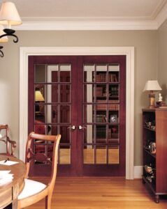 Wooden french door with clear glass panels.