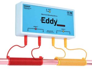 Eddy electronic descaler unit connected to two red and yellow wires that are coiled around the pipe.