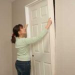 placing interior door in jamb