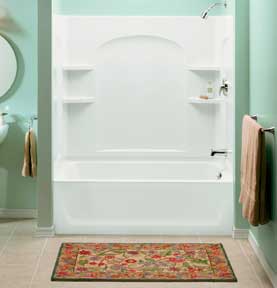 Bathtub with a shower enclosure unit in a mint-green room.