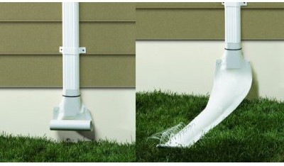 White automatic recoiling downspout attached to a house's drain pipe.