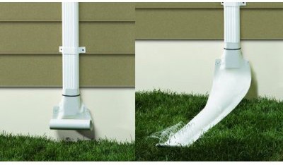 White automatic recoiling downspout attached to a house’s drain pipe.