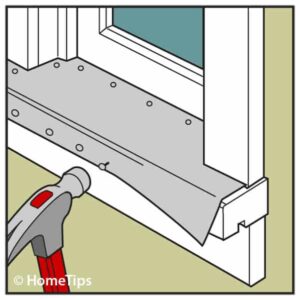 Drawing of a trimmed aluminum sheet nailed underneath a window sill using a hammer.