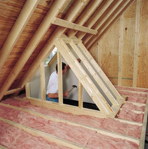 Framing for a light shaft that will funnel light from the roof to the room below is built in this attic. When the framing is finished, drywall will be added.