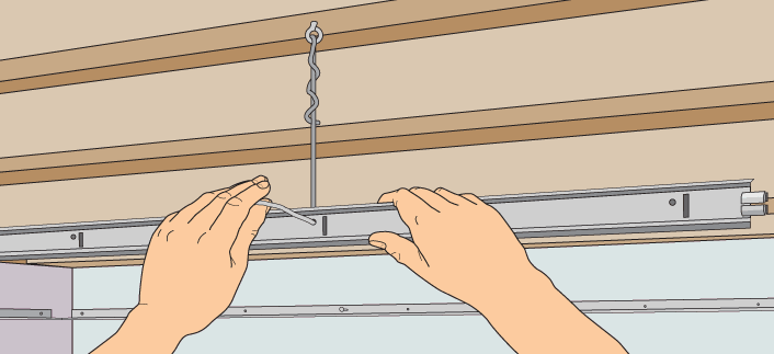 hanging suspended ceiling tracks from twisted wires attached to joists