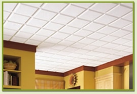 A suspended ceiling of white acoustic panels.