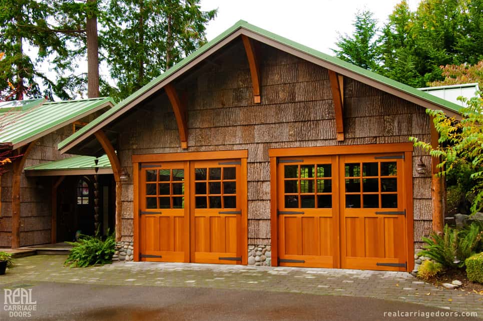 Craftsman bungalow-style garage with swing-out, real wood carriage, dual garage doors.