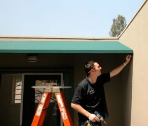 Installing an awning is a inexpensive way to reduce solar heat gain. Photo: © HomeTips