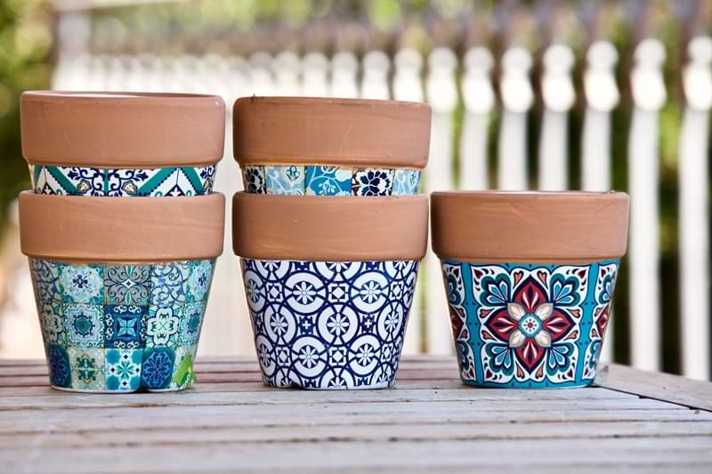 Ceramic flower pots with decorative designs.