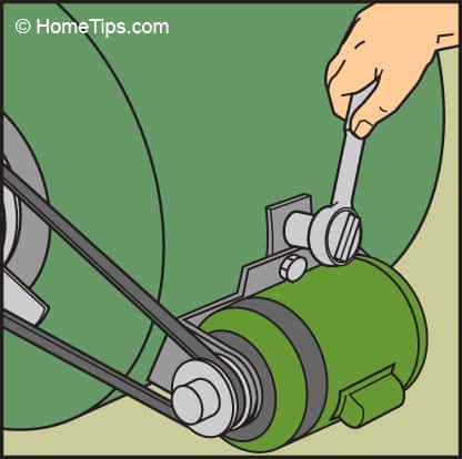 Diagram of a hand loosening the motor mount with a socket wrench.