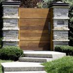 wooden gate stone pillars