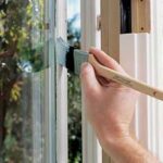 painting window with sash brush