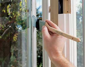 painting window with sash brush