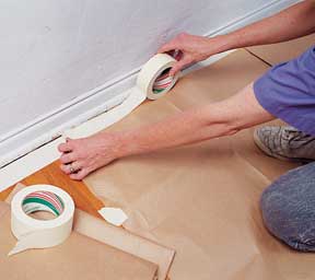 Tape protective drop cloths to the floor, and then the walls.
