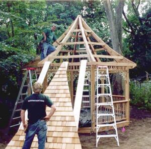 Kit gazebo's roof panel is lifted into place. Photo: Summerwood Outdoors Inc.