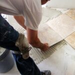 laying stone floor tile