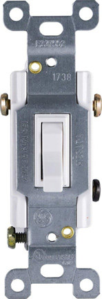 Bare 3-way light switch without faceplate over a white background.