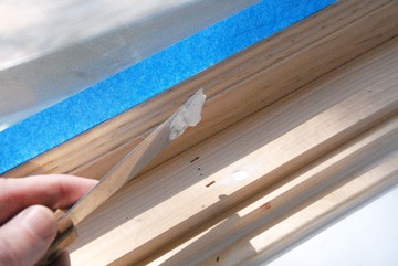 Fill holes in woodwork with spackling compound and sand smooth before painting.