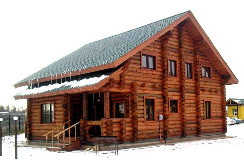 Mountain lodge-style home is built from log construction.