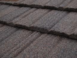 Brown stone-coated steel shingle roofing.