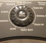 Timer and control buttons of an electric clothes dryer.