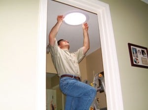 The final step of installing a tubular skylight is mounting its trim on the ceiling.