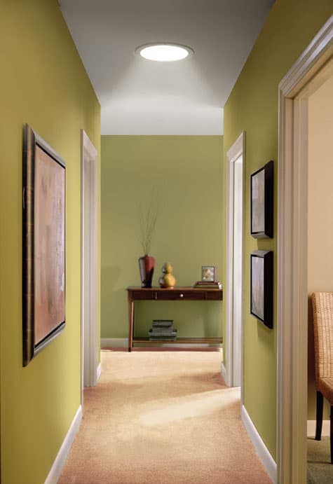 A new tubular skylight transforms an otherwise dark hallway with natural light.