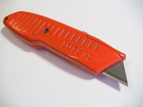 A utility knife is all that's needed for making straight cuts across drywall.