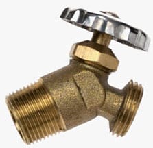 A brass water heater drain valve with a silver handwheel.
