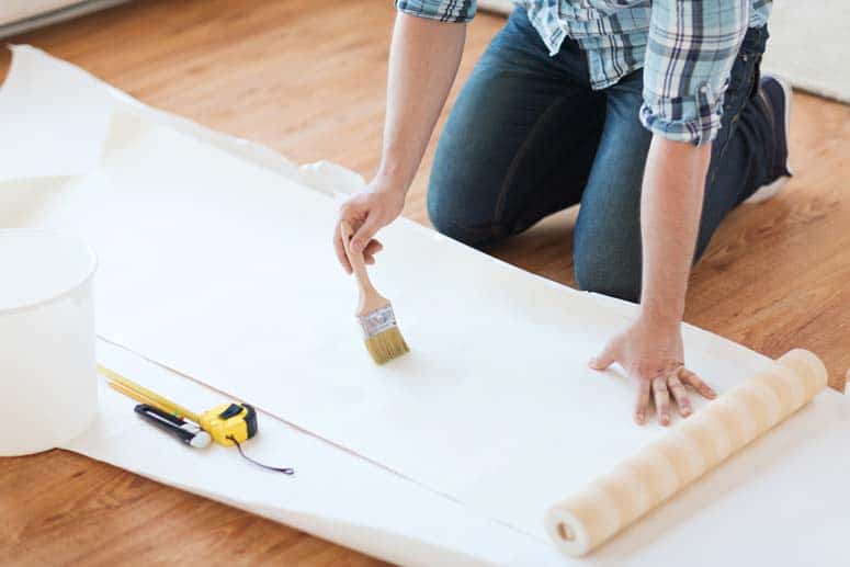 Apply paste to the back of the wallpaper strip.