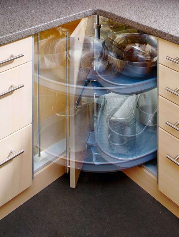 Lazy-Susan corner cabinet hardware takes advantage of lost space while making the cabinet's contents easily accessible.