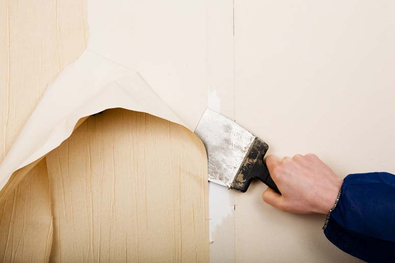 A flat scraper can do an effective job of removing certain types of wallpaper.